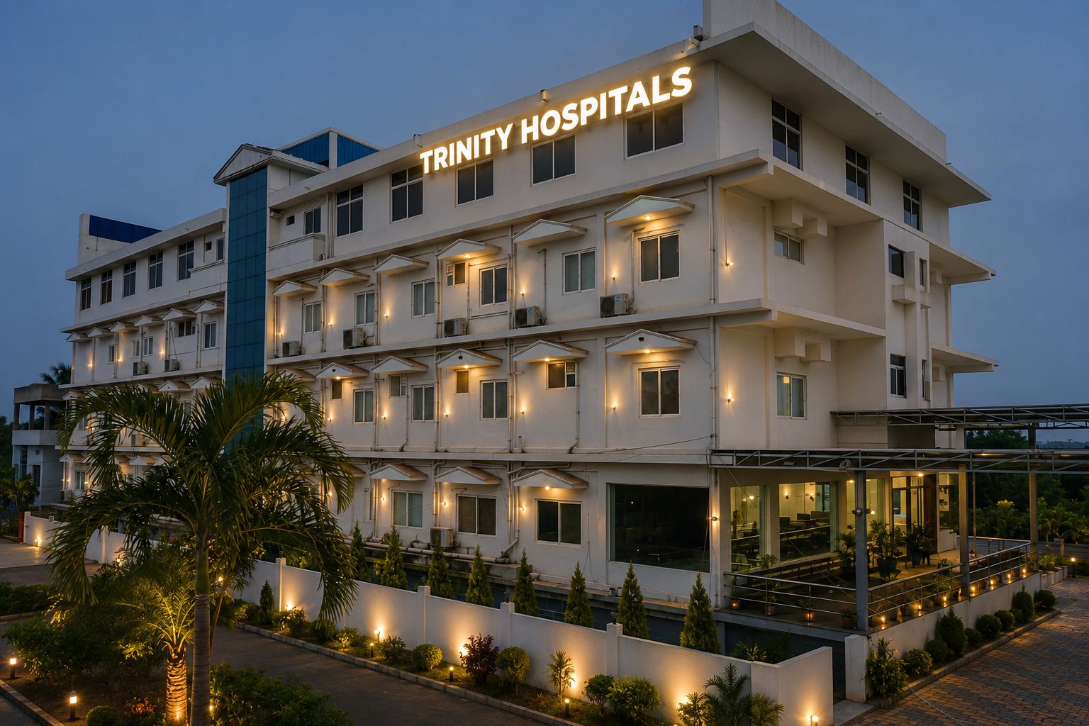 Trinity Hospitals building illuminated at dusk